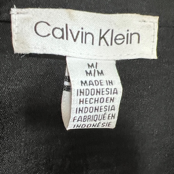 Calvin Klein Black Button Down Shirt with gold button accents. - Picture 3 of 6